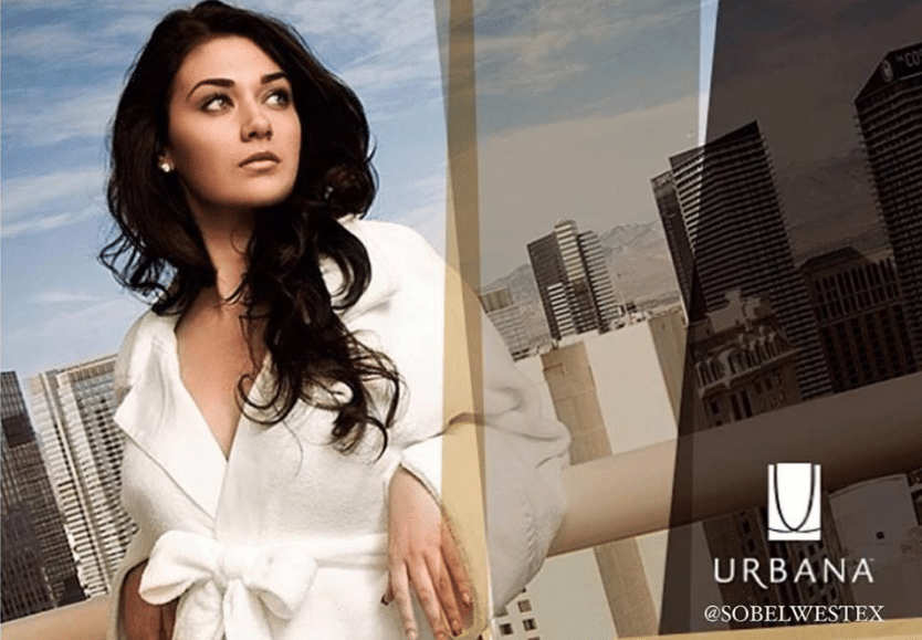 Beautiful model on urban high rise outdoor deck wearing Sobel Westex Urbana robe
