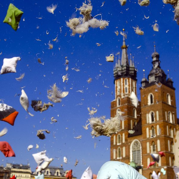 Flying pillow feathers and down during international pillow fight day