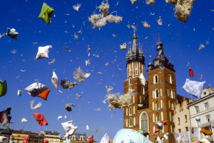 Flying pillow feathers and down during international pillow fight day