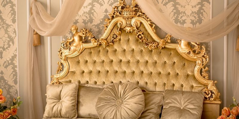 Royal bedroom interior. Interior of classic style bedroom in luxury villa. Beautiful royal and classical living room interior with a large bed in expensive apartment.