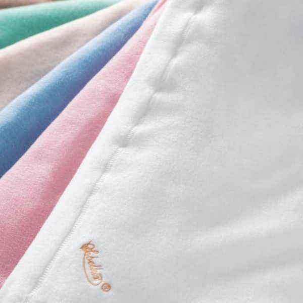 Sobel Westex fleece blankets laid out to show 5 pastel colors