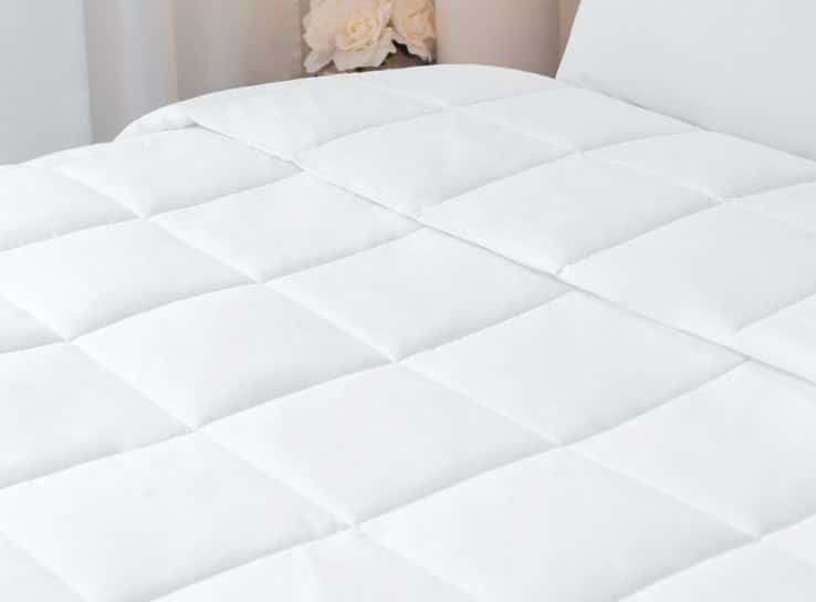 Sobella duvet luxury white quilted duvet displayed on hotel bed