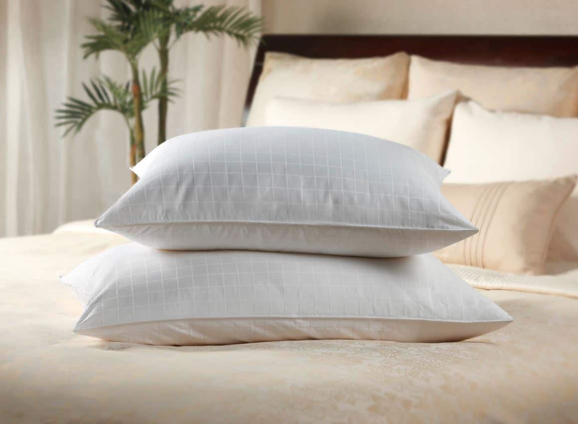 two luxury pillows stacked on cruise ship bed
