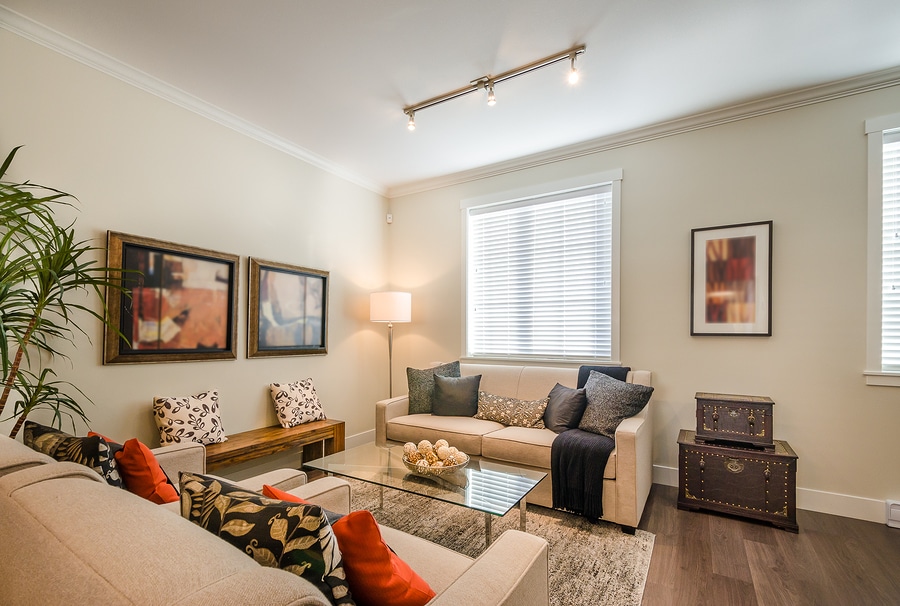 warm living room with many fall color throw pillows