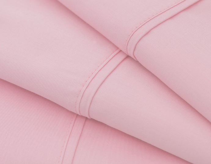 close up view of double seam on sobella sateen sheets in rose pink