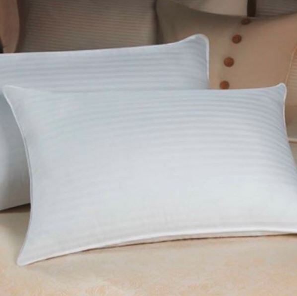 Dolce Notte II pillows displayed on hotel style bed
