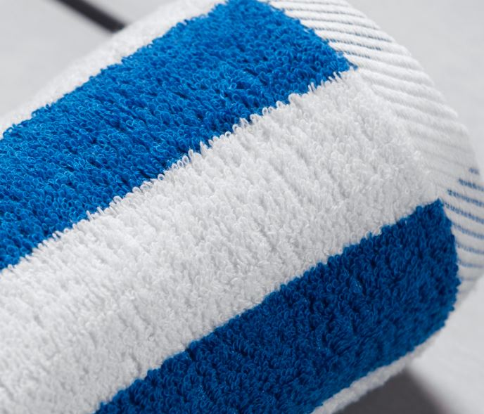 Sobel Westex Home pool towel rolled up blue and white