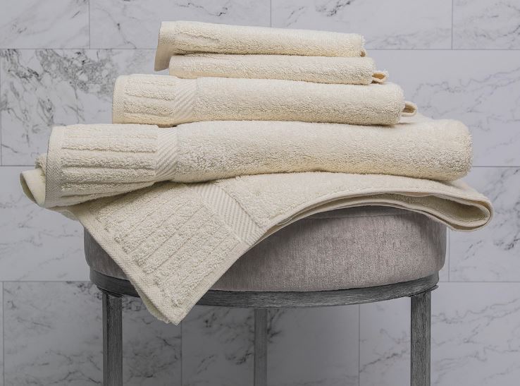 Sobel Westex Sobella luxury bath set natural color towels stacked on a bathroom table