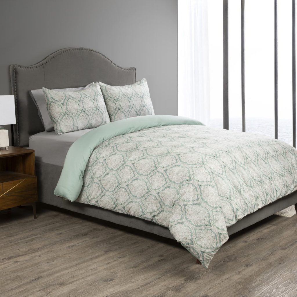 Sobel Westex Duchess of York collaboration Emerald Damask comforter set in light green and classic pattern modeled on hotel bed