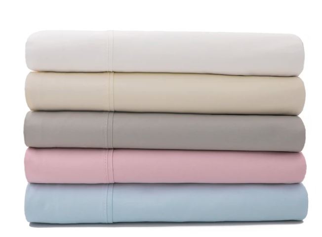 Sateen cotton sheets by Sobel Westex stacked to show five colors light blue, rose, taupe, ivory and white