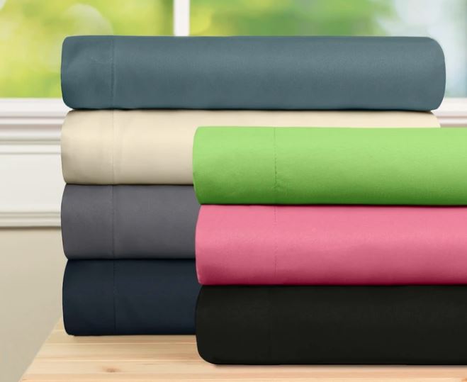 Baltic Linen microfiber sheets in 8 colors folded on wooden table