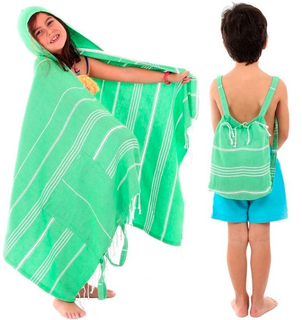 two kids modelling green stripped beach towel that doubles as a backpack