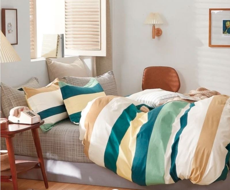bedroom with fluffy blue yellow white striped comforter by Sobel Westex casual look bedroom