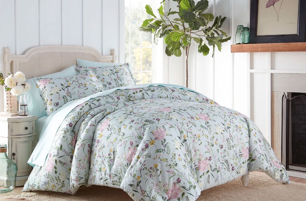 Sobel Westex Duchess Collection Apriol Buoquet Comforter Set in pink, green and purple flower patter displayed ona soft pink double bed