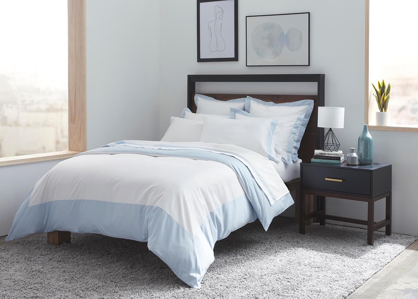 sobel Westex pure elegance sateen duvet set in blue and white displayed on a double bed