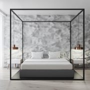 Interior of modern bedroom with white walls, concrete floor, white Egyptian cotton sheets, master bed and loft windows.