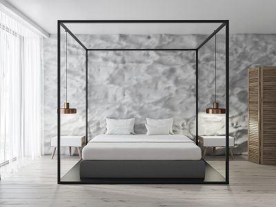 Interior of modern bedroom with white walls, concrete floor, white Egyptian cotton sheets, master bed and loft windows.
