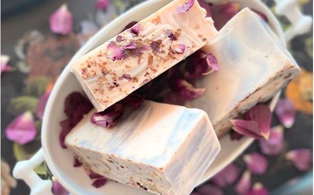 Sobel Westex Urbana Spa organic soap tea infused three cakes covered with purple lavender leaves