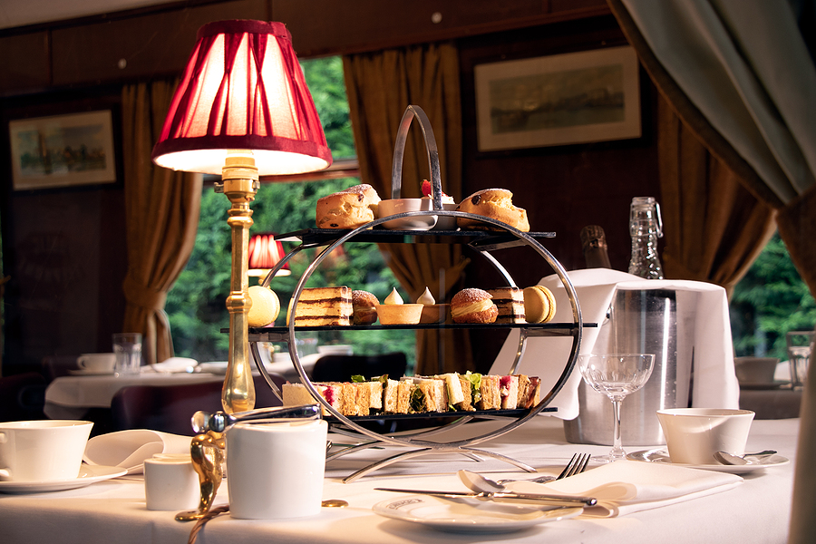 Afternoon tea service aboard a luxury train like the Orient Express