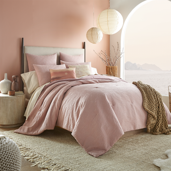 Sobel Westex Star Wars™ Bedding Collection Tatooine™ Comforter set in pink and beige with desert sun pillow in desert style and tan chain throw bedroom setting