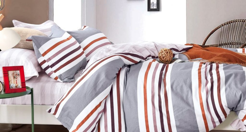 Denver striped comforter set, gray and white with colorful stripes on double bed