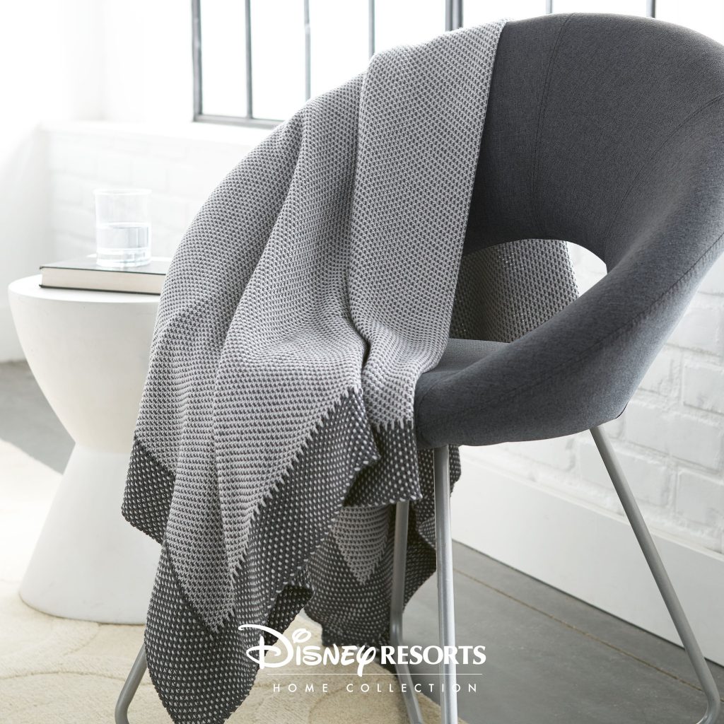 Metropolitan throw from Disney Resorts Home Collection Gray and white throw with contemporary design