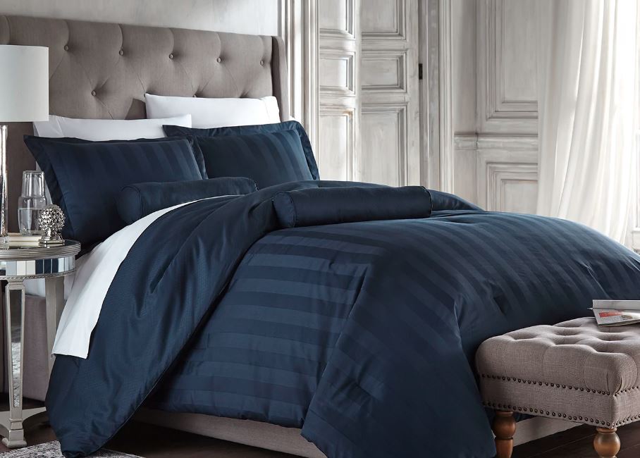 Midnight blue Reversible Diamond Stripe Bed Set from Sobel displaed on Queen hotel bed