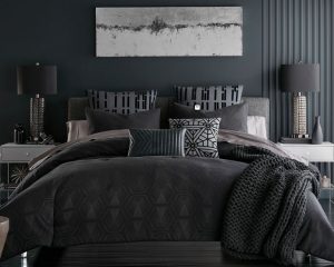 Hotel Linen: Sobel Westex Star Wars™ bedding set in grays and white matte and opaque on double bed comforter pillow shams decorator pillows in Death Star patterns