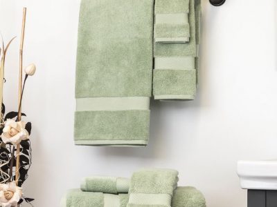 Green Sobel luxury bath towels hanging on towel rack