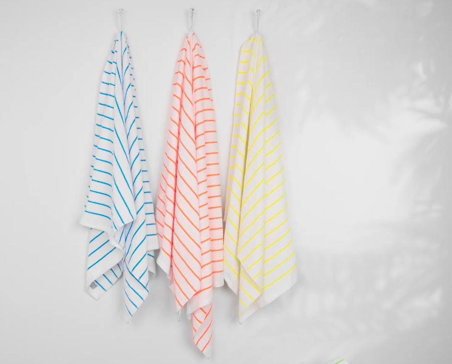 https://blog.sobelathome.com/wp-content/uploads/2023/04/hanging-beach-towels.jpg