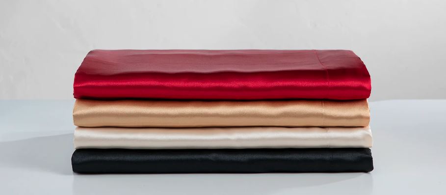 silky satin bed sets in various colors red, ivory, white, and black