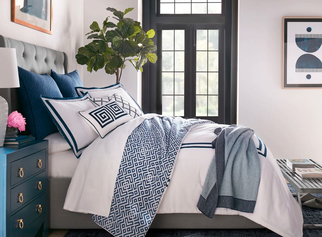 Luxury bed in simple blue and white with quality bedding materials