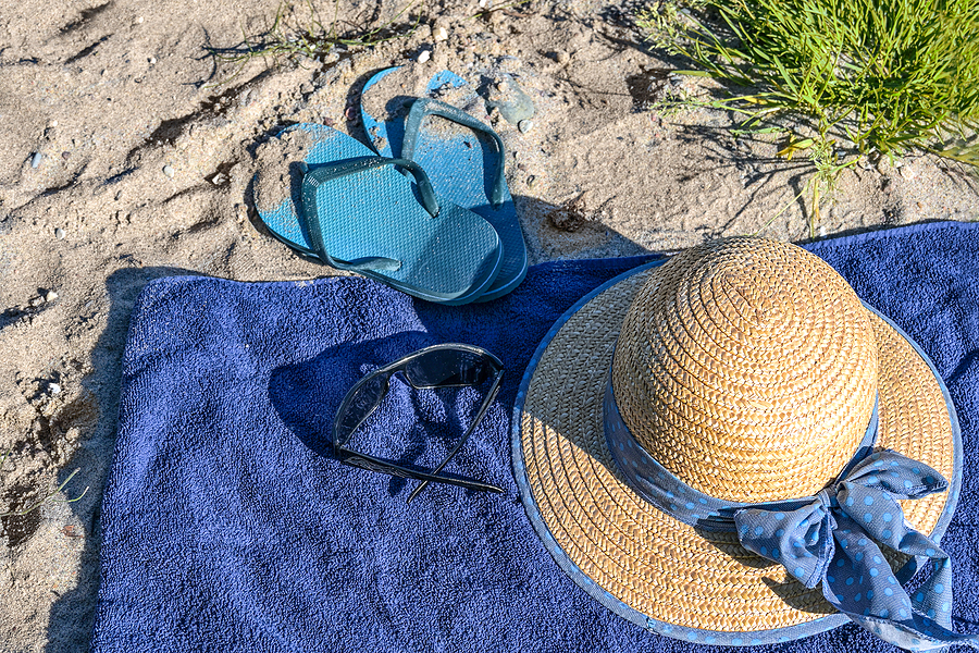 beach towel with hat and sandals